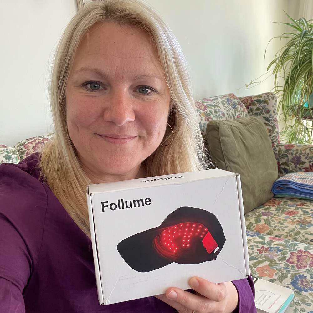 AI-generated packaging mockup: woman holding a Follume-branded box.